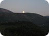 The moon rolling over and down the hills....